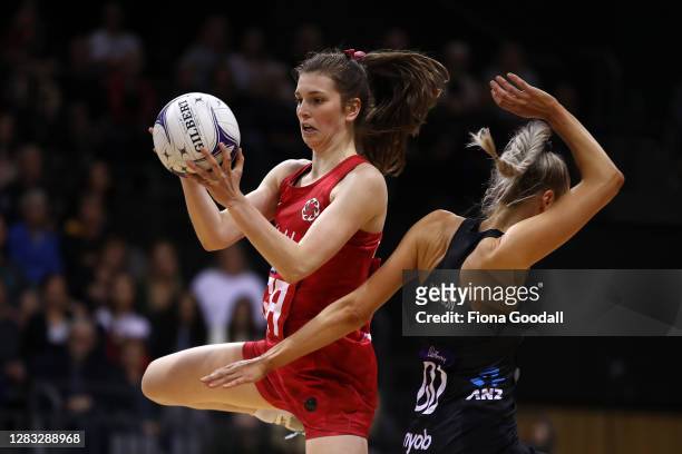 Sophie Drakeford-Lewis of England takes the ball under pressure from Jane Watson of New Zealand during game 3 of the Cadbury Netball Series between...