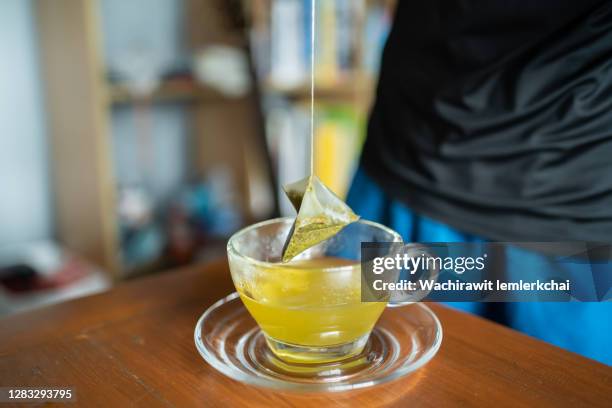 making a cup of green tea - steeping stock pictures, royalty-free photos & images