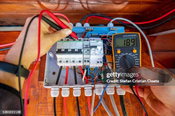 electrician measurements with multimeter tester system ready - electrical fuse box stock pictures, royalty-free photos & images