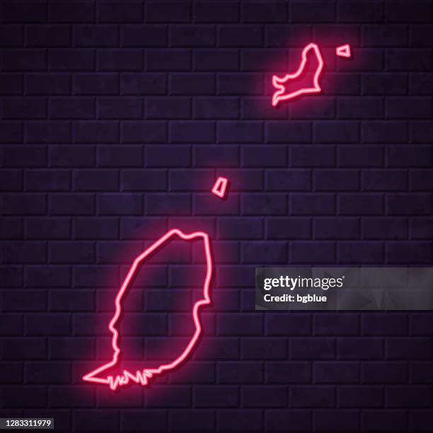 grenada map - glowing neon sign on brick wall background - grenada caribbean map stock illustrations
