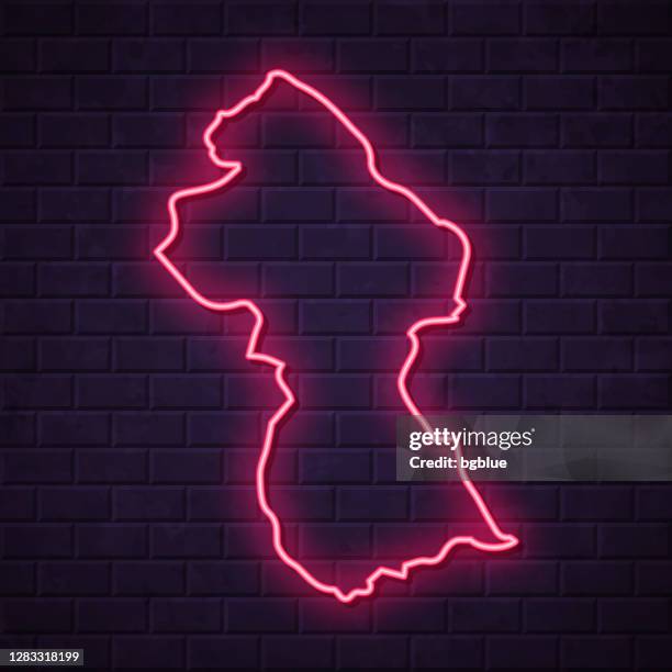 guyana map - glowing neon sign on brick wall background - georgetown stock illustrations