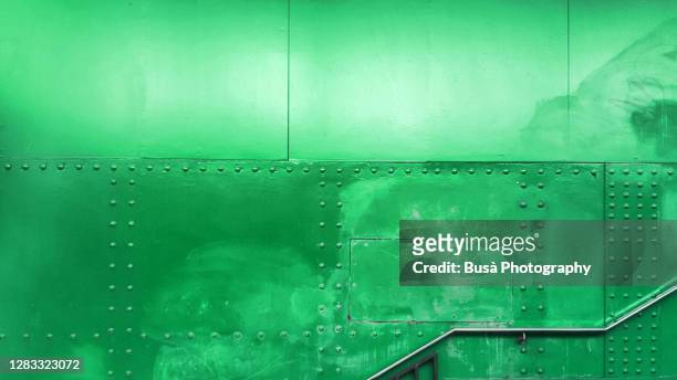 staircase with riveted metal panels in the background - rust deutschland stock-fotos und bilder
