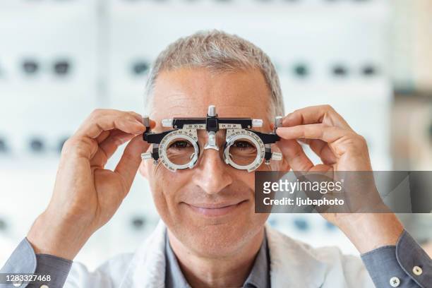 trust him to take care of your eyes - ophthalmologist chart stock pictures, royalty-free photos & images