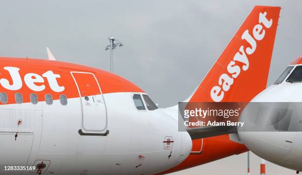 Easyjet planes sit on the tarmac on the first full day of public operation of the new BER Berlin Brandenburg Airport on November 1, 2020 in...