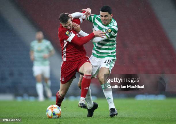 Tom Rogic of Celtic battles for possession with Lewis Ferguson of Aberdeen during the William Hill Scottish Cup second semi-final match between...