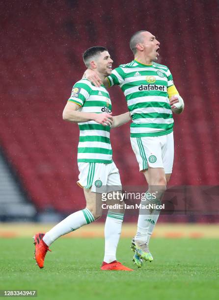 Ryan Christie of Celtic celebrates with teammate Scott Brown after scoring his sides first goal during the William Hill Scottish Cup second...