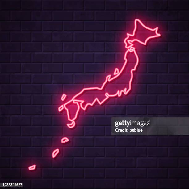 japan map - glowing neon sign on brick wall background - japan billboard stock illustrations