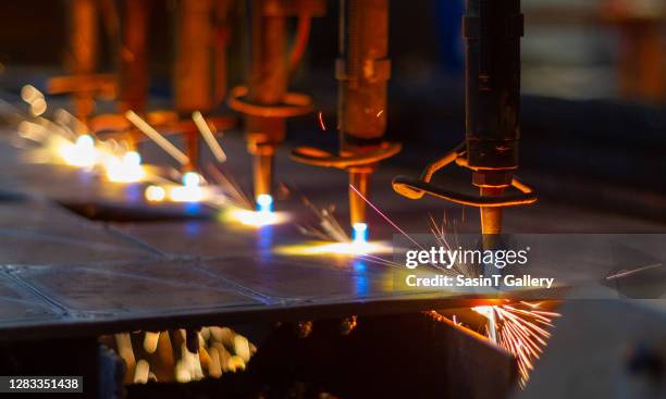 cnc lpg cutting with sparks close up - laser cutting stock pictures, royalty-free photos & images