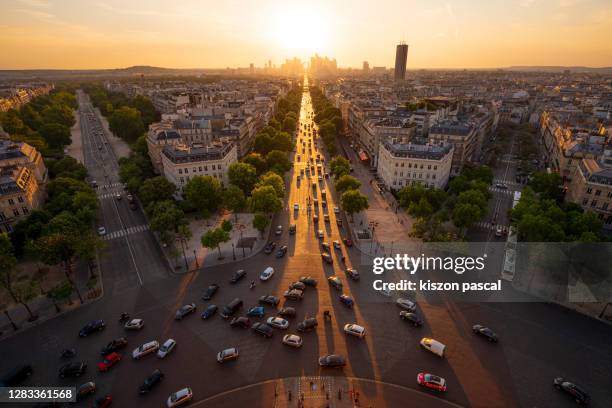 aerial view of paris in france with the grande armee avenue during sunset . - bairro de champs elysées imagens e fotografias de stock