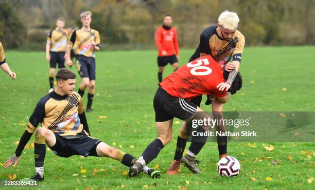 Players challenge for the ball during Sunday league football match between Linchfield Lions and Boldmere Wanderers on November 01, 2020 in Lichfield,...