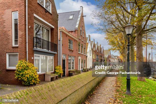 typical dutch architecture in muiden, holland - village stockfoto's en -beelden