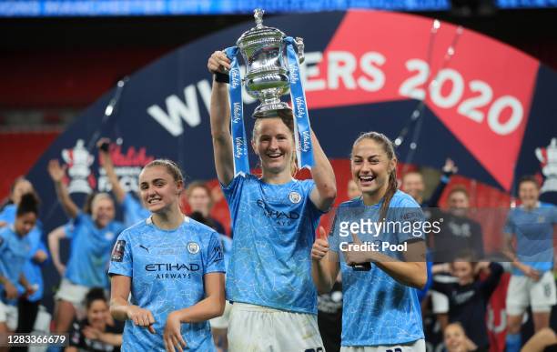Georgia Stanway, Sam Mewis and Janine Beckie of Manchester City celebrate with the Vitality Women's FA Cup Trophy following their team's victory in...