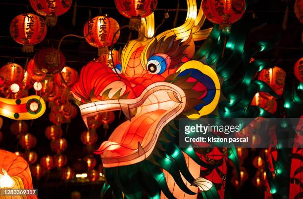 chinese traditional dragon lantern illuminated at night . - chinese festival stock pictures, royalty-free photos & images