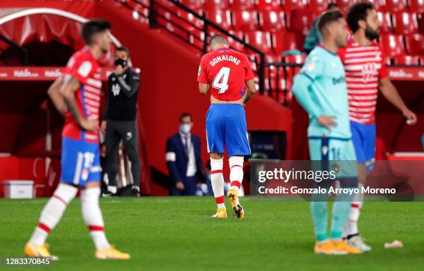 Maxime Gonalons of Granada CF leaves the pitch after receiving a red card during the La Liga Santander match between Granada CF and Levante UD at...
