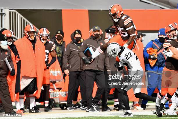 Tight end David Njoku of the Cleveland Browns is pushed out-of-bounds by cornerback Trayvon Mullen Jr. #27 of the Las Vegas Raiders after a reception...