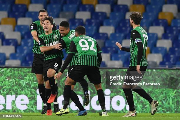Maxime Lopez of US Sassuolo celebrates after scoring the 0-2 goal during the Serie A match between SSC Napoli and US Sassuolo at Stadio San Paolo on...