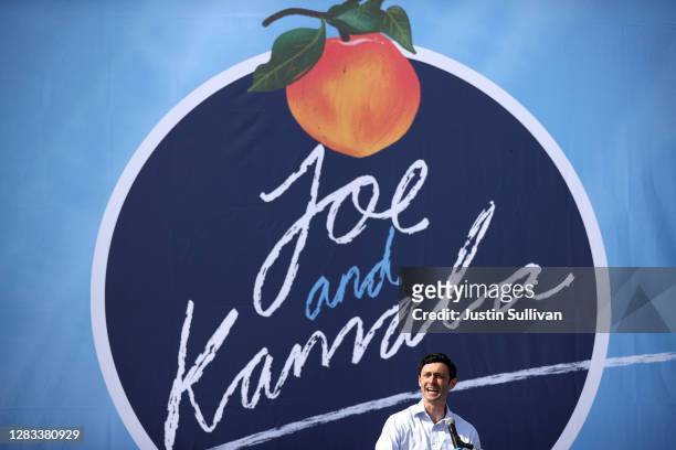 Democratic candidate for U.S. Senate Jon Ossoff speaks during a drive-in campaign event for Vice Presidential Nominee Sen. Kamala Harris at the...