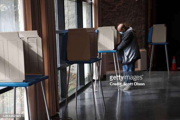 Resident casts a ballot at a polling place set up for early voting on November 01, 2020 in Racine, Wisconsin. Today is the final day for early voting...