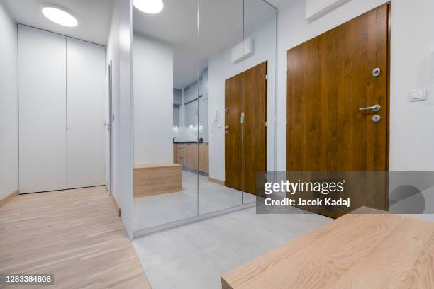 modern domestic corridor - wall mirror stock pictures, royalty-free photos & images