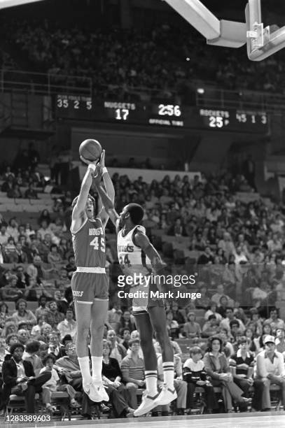 Rudy Tomjanovich of the Houston Rockets shoots a jumper over Gary Garland during a game against the Denver Nuggets at McNichols Arena on February 17,...