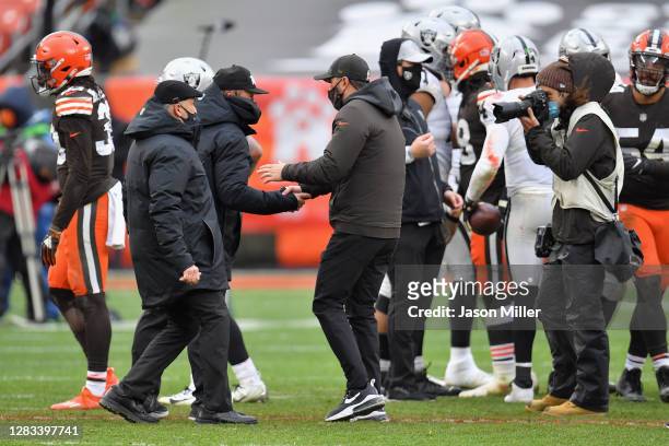 Head coaches Jon Gruden of the Las Vegas Raiders and Kevin Stefanski of the Cleveland Browns shake hands following the NFL game at FirstEnergy...