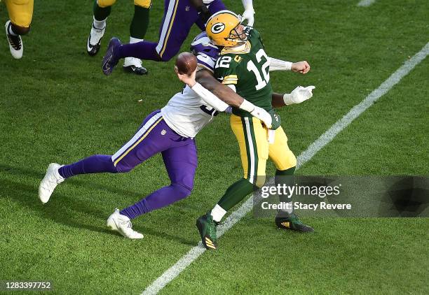 Wonnum of the Minnesota Vikings sacks Aaron Rodgers of the Green Bay Packers during the fourth quarter to win the game at Lambeau Field on November...