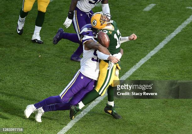 Wonnum of the Minnesota Vikings sacks Aaron Rodgers of the Green Bay Packers during the fourth quarter to win the game at Lambeau Field on November...