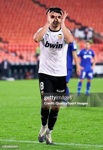 Carlos Soler of Valencia CF celebrates after scoring his team's second goal during the La Liga Santander match between Valencia CF and Getafe CF at...