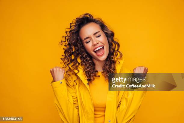 woman in raincoat - nice weather stock pictures, royalty-free photos & images