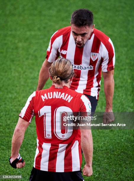 Iker Muniain of Athletic Club celebrates with his teammate Unai Lopez of Athletic Club after scoring the opening goal during the La Liga Santander...