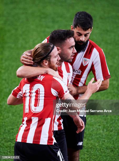 Iker Muniain of Athletic Club celebrates with his teammate Unai Lopez of Athletic Club after scoring the opening goal during the La Liga Santander...