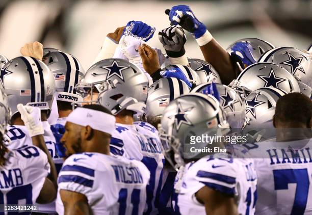 The Dallas Cowboys huddle together on the field prior to their game against the Philadelphia Eagles at Lincoln Financial Field on November 01, 2020...