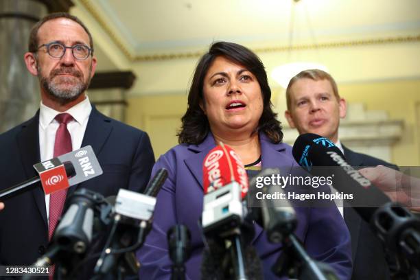 Newly appointed minister Ayesha Verrall speaks to media while ministers Andrew Little and Chris Hipkins look on at Parliament on November 02, 2020 in...