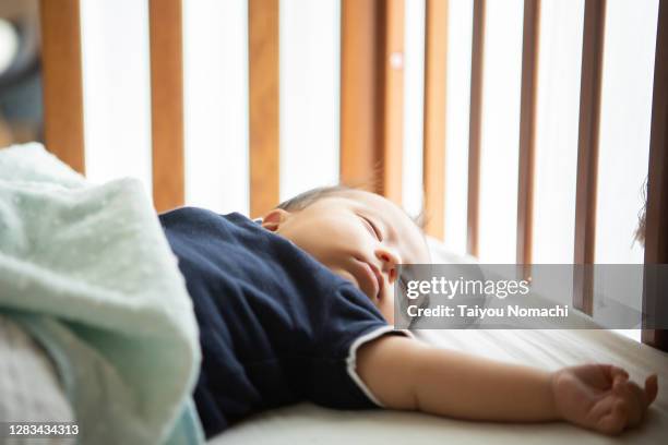 a two-month-old baby boy who is napping - sleep hygiene stock pictures, royalty-free photos & images