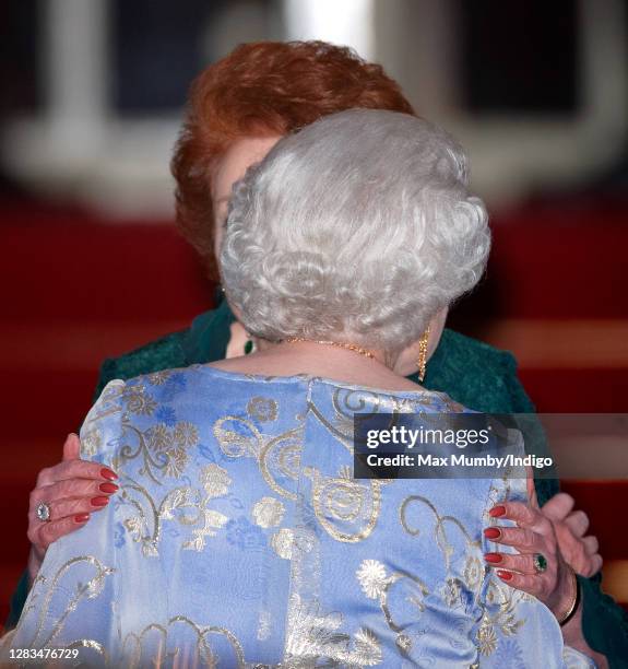 Lady Elizabeth Shakerley embraces Queen Elizabeth II as they attend a pre-wedding gala dinner on the eve of the Royal Wedding of Prince William to...