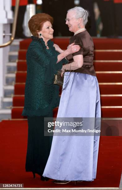 Lady Elizabeth Shakerley greets Queen Margrethe II of Denmark as they attend a pre-wedding gala dinner on the eve of the Royal Wedding of Prince...