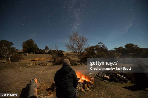 relaxing by the campfire - australian winter landscape stock pictures, royalty-free photos & images