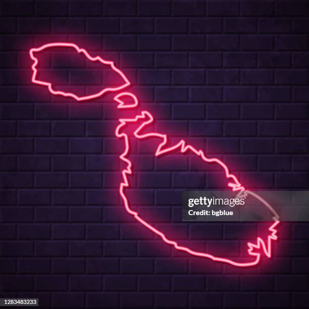 malta map - glowing neon sign on brick wall background - malta stock illustrations