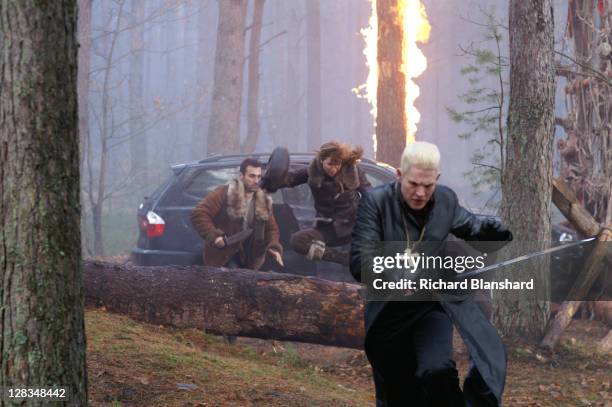 From left to right, British actor Adrian Paul as Immortal warrior Duncan MacLeod, Dutch actress Thekla Reuten as his wife Anna Teshemka, and English...