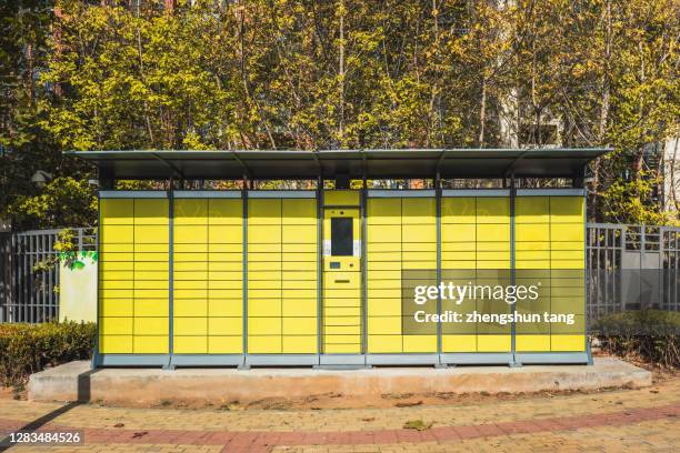 colorful mail boxes in the residential area. - taquilla recipiente fotografías e imágenes de stock