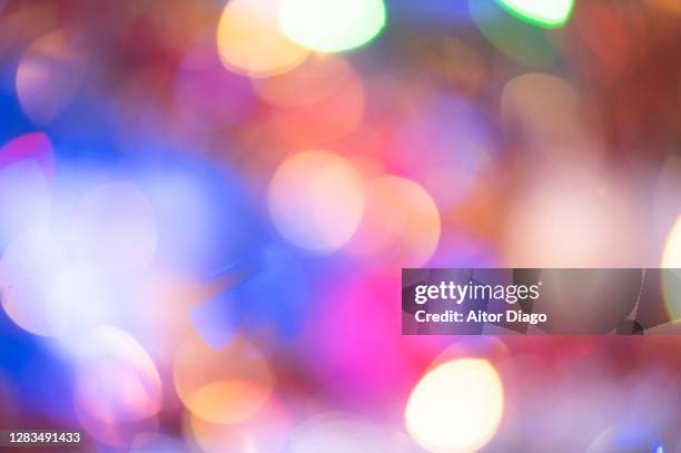 colorful christmas lights out of focus for background - advent party stock pictures, royalty-free photos & images