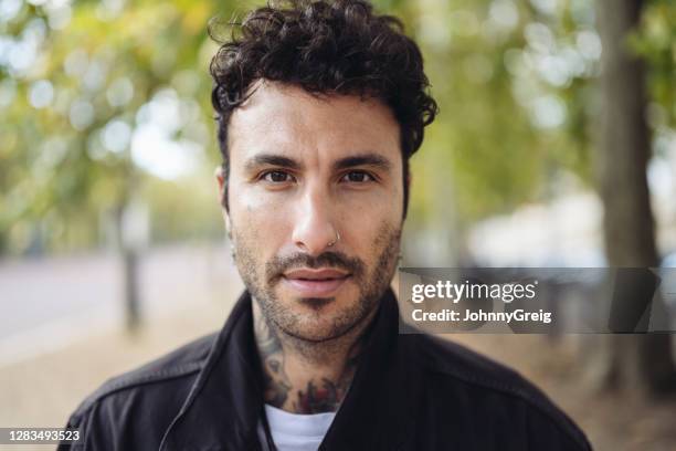 outdoor portrait of mid 30s caucasian male with neck tattoo - pierced nose stock pictures, royalty-free photos & images