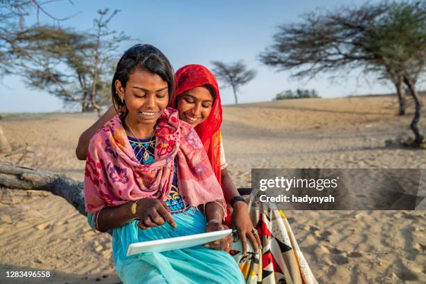 happy gypsy indian girls using digital tablet, india - rajasthani youth stock pictures, royalty-free photos & images