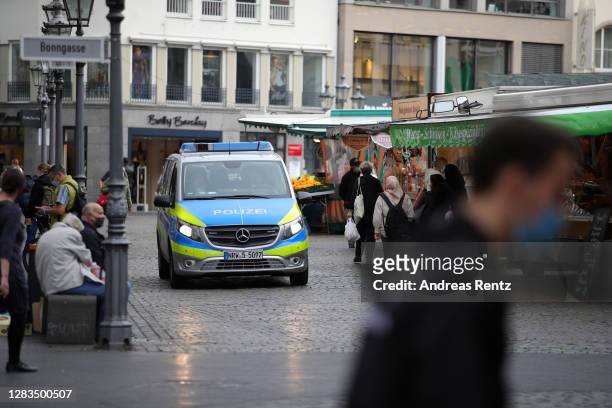 Police car drives through the pedestrian zone in the city center on the first day of a four-week semi-lockdown during the second wave of the...