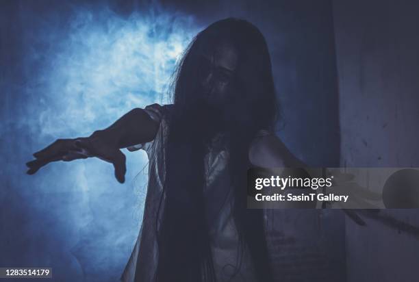 horror woman ghost creepy standing show two hands at the house - zombie stock pictures, royalty-free photos & images