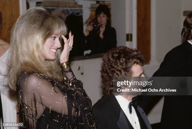 American actress and singer Susan Anton and British actor, comedian and pianist Dudley Moore attend the 40th Annual Golden Globe Awards, held at the...