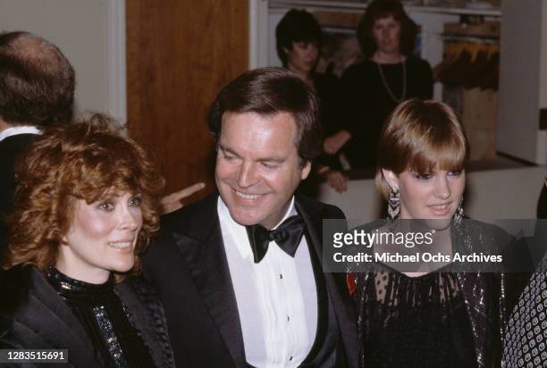 American actress Jill St John, American actor Robert Wagner, and Wagner's daughter Katie Wagner attend the 40th Annual Golden Globe Awards, held at...