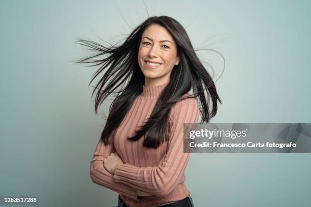 portrait of beautiful young lady - blowing hair stock pictures, royalty-free photos & images