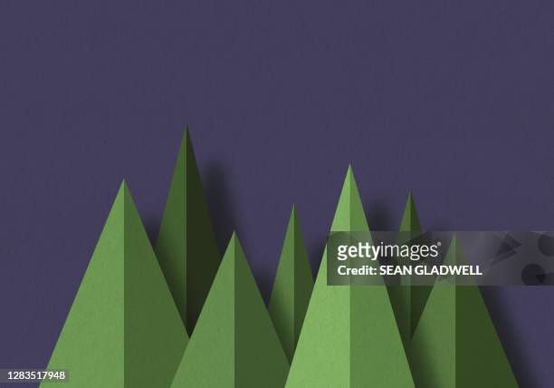 graphic paper trees - green christmas designs stock-fotos und bilder