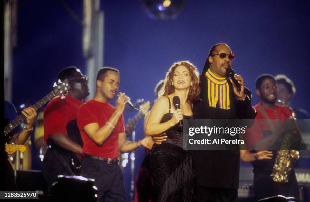 Musicians Gloria Estefan and Stevie Wonder perform at the Super Bowl XXXIII Halftime Show on January 31, 1999 in Miami.